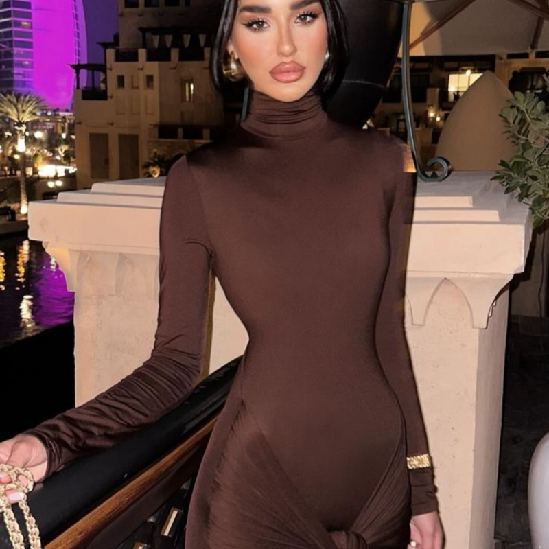Woman wearing elegant brown bodycon dress with high neck and draped waist, styled for an evening dinner in Dubai.