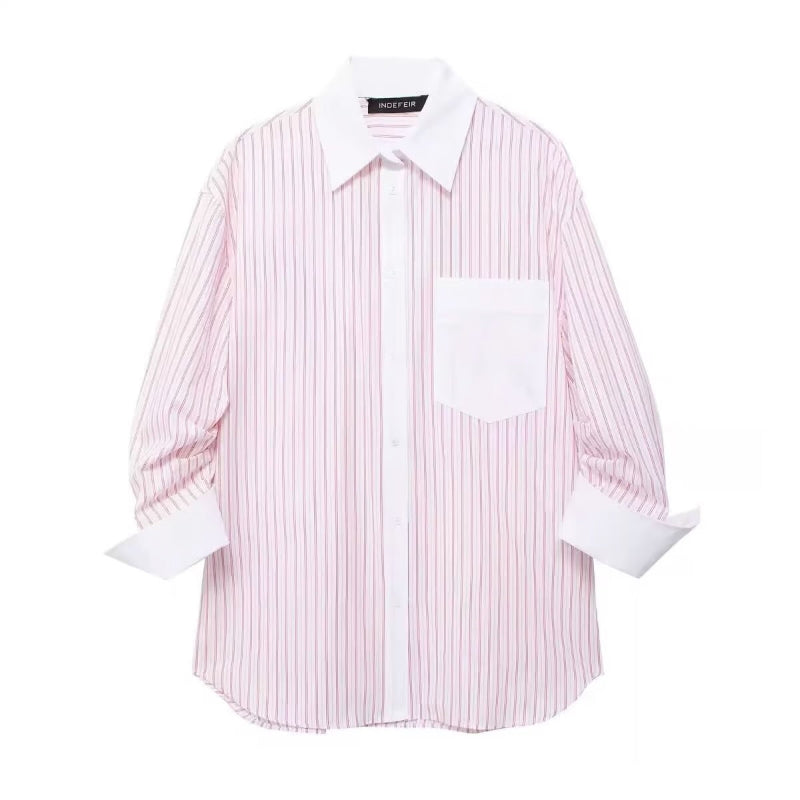 Oversized women’s pink striped button‑down shirt – long sleeves, white contrast collar and cuffs, chest pocket, lightweight poplin fabric, casual summer style.