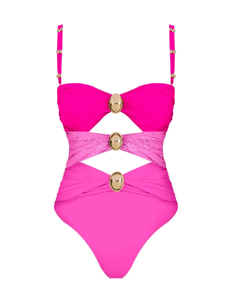 Luxury cut-out one piece swimsuit in bold pink with gold ring details and matching wrap skirt – Chic & Charm beachwear, seamless, wire-free, flattering fit for summer vacation or resort look.