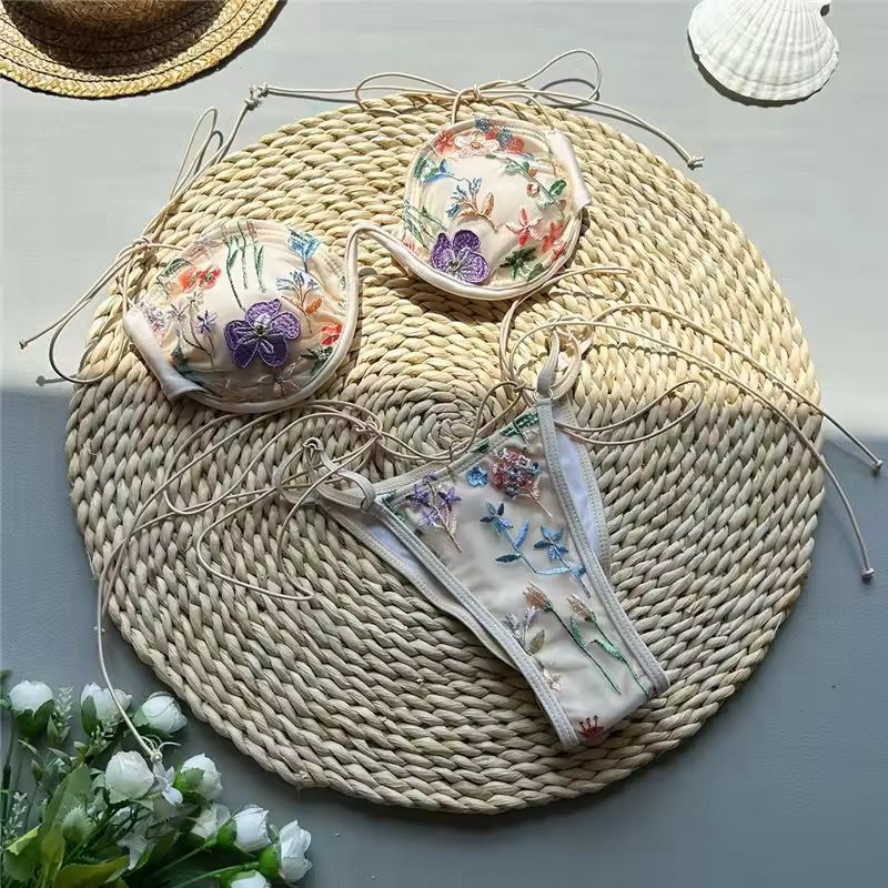 Embroidered push-up bikini for women with delicate floral details and adjustable thong bottoms.