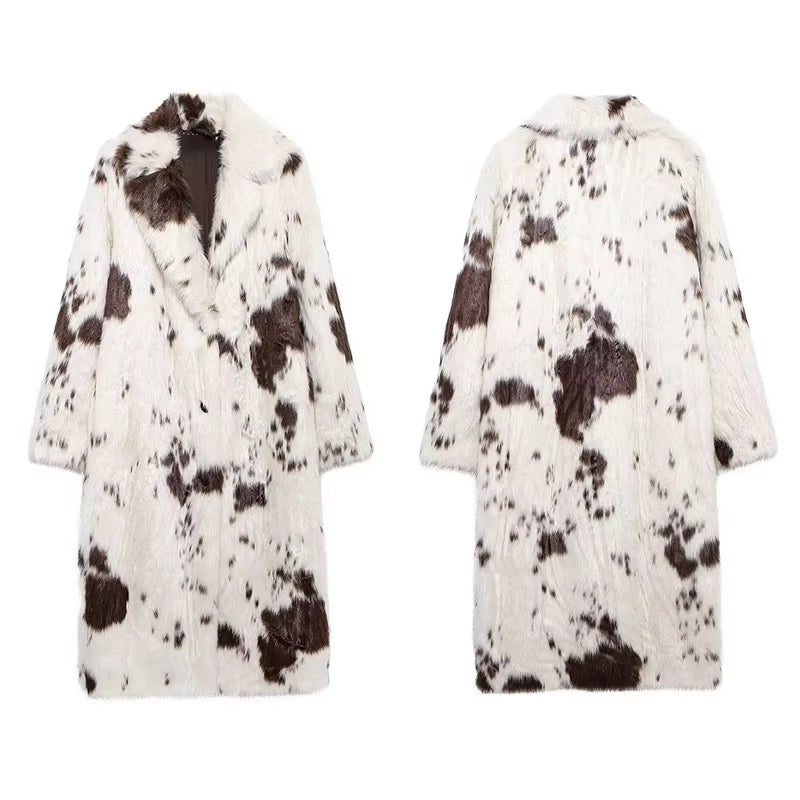 Long white faux fur coat with cow print, stylish women's outerwear, trendy faux fur coat, elegant fashion statement, chic casual coat, sustainable women's fashion, versatile winter coat.