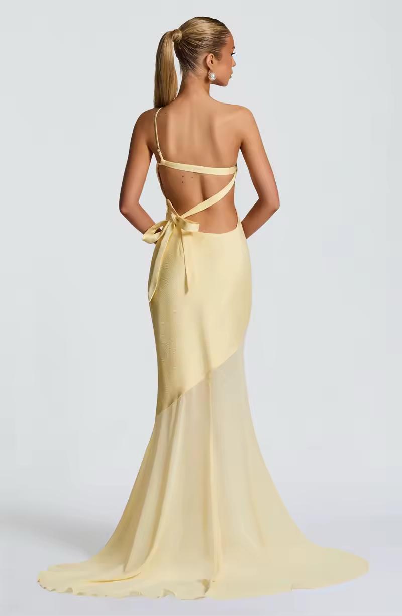 Backless yellow long dress with one-shoulder neckline and floor-length silhouette for special events