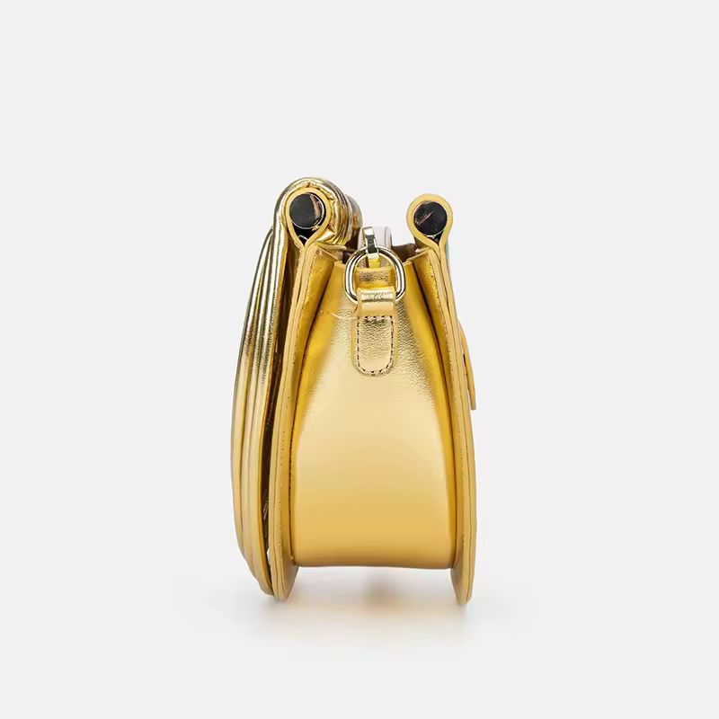 Luxury gold fan-shaped clutch bag Ventaglio d’Oro – structured metallic designer handbag with sculptural design.