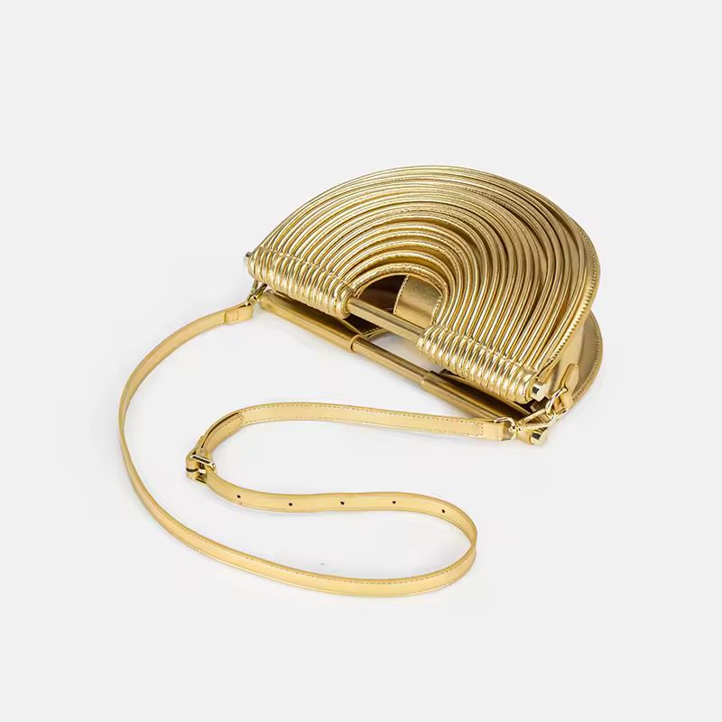 Luxury gold fan-shaped clutch bag Ventaglio d’Oro – structured metallic designer handbag with sculptural design.