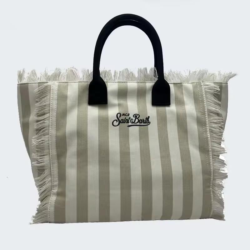 Saint Barth beach bags in hot pink, leopard print, ivory and natural straw – colorful canvas totes with boho vibe for summer 2025.