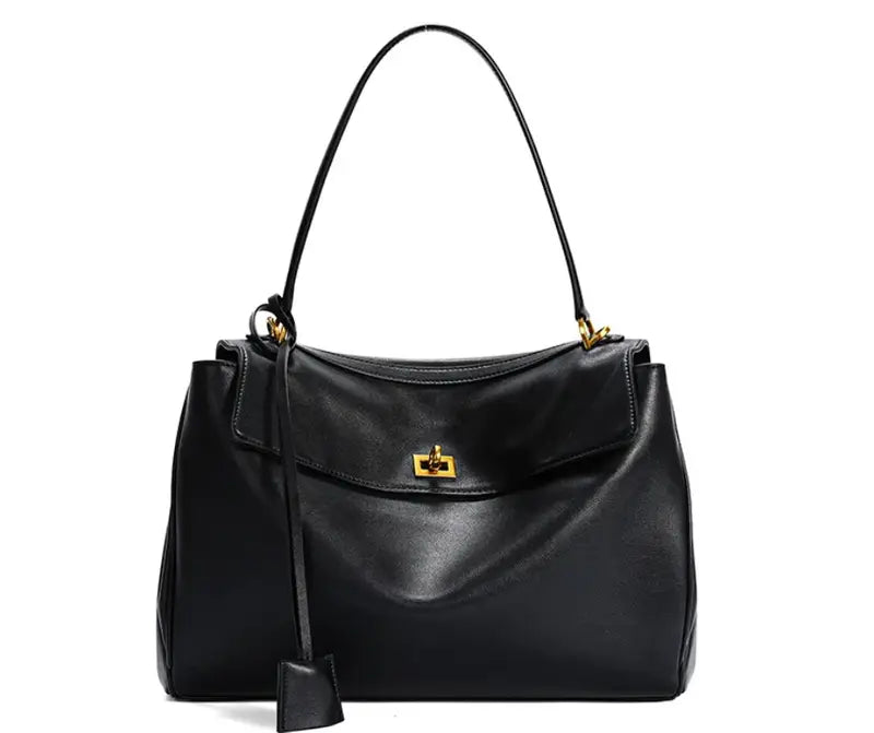 The Elegance Suede Handbag is a true masterpiece crafted from high-quality suede, blending luxury and functionality perfectly. Available in two elegant colors – Light Brown and Dark Brown – this exquisite bag features a sophisticated gold buckle, enhancing its design and adding a modern yet timeless look. With generous dimensions of 23 cm x 11 cm x 35 cm, it offers ample space for all your essentials, from smartphones to cosmetics and more, making it the ideal companion for any occasion.