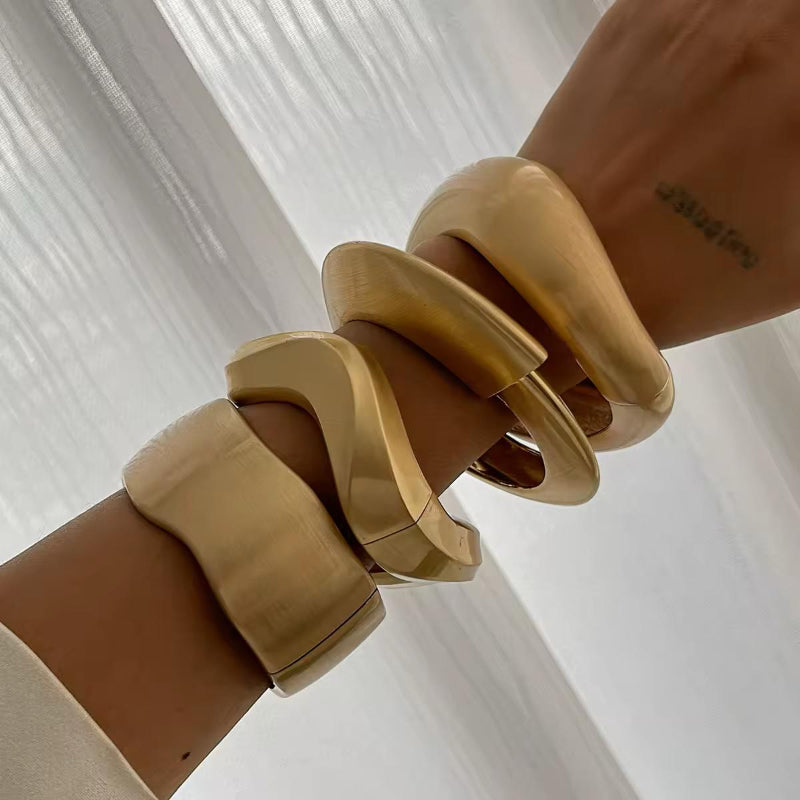 Luxury statement cuff in brushed gold finish, bold and timeless accessory for men and women