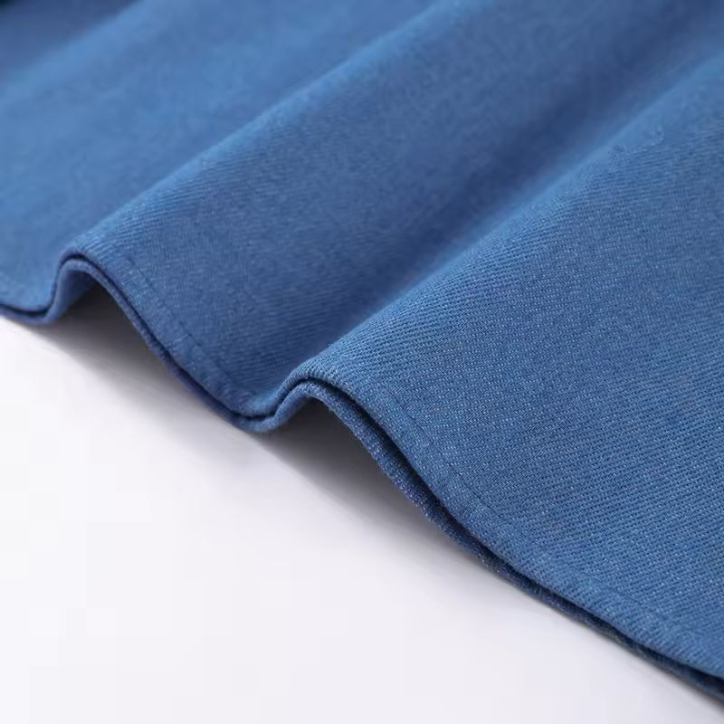 Light blue pleated midi dress flowing in motion – breathable fabric for warm weather