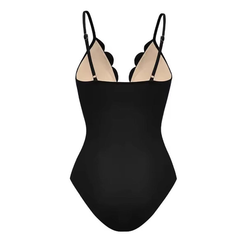 Chic black three-piece women’s set featuring floral laser-cut details – includes a scalloped bodysuit with thin adjustable straps and deep V-neckline, paired with a flowy high-waisted maxi skirt. Made from soft polyester-spandex blend. Perfect for beachwear, resort looks, or elegant summer outfits.