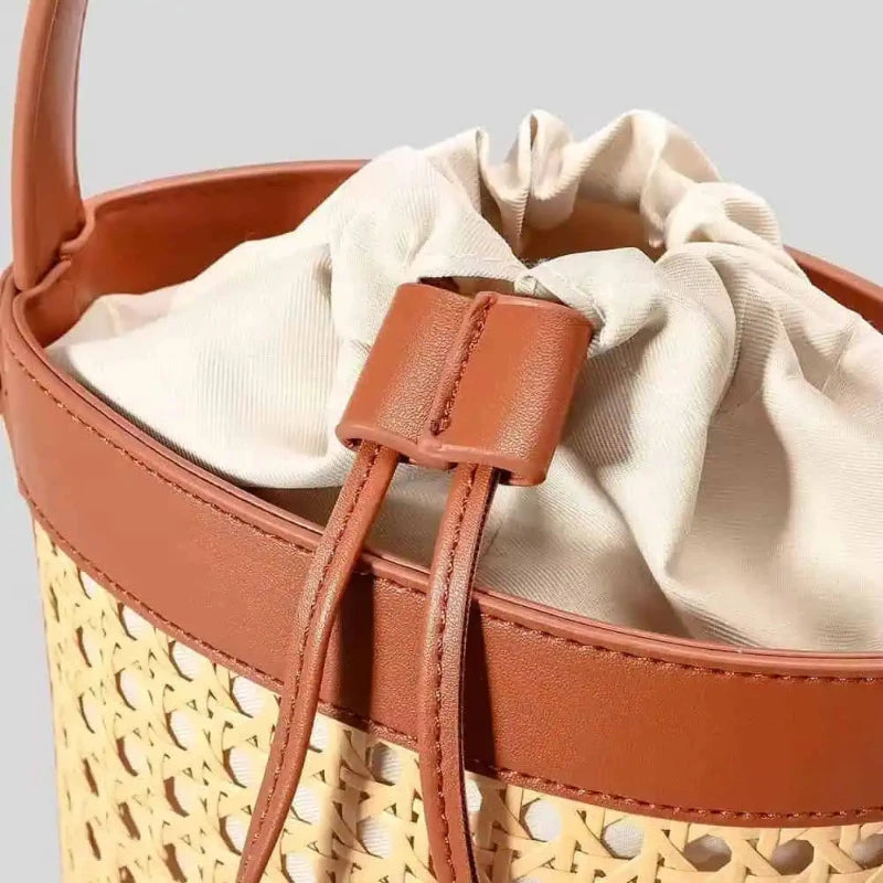 Close-up of the CORA Bag’s premium PU leather accents and handwoven rattan texture – elegant craftsmanship meets natural style.