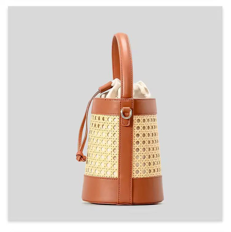 The CORA Straw Shoulder Bag styled on a picnic setup – the perfect accessory for beach days, weekend getaways and vacation looks.