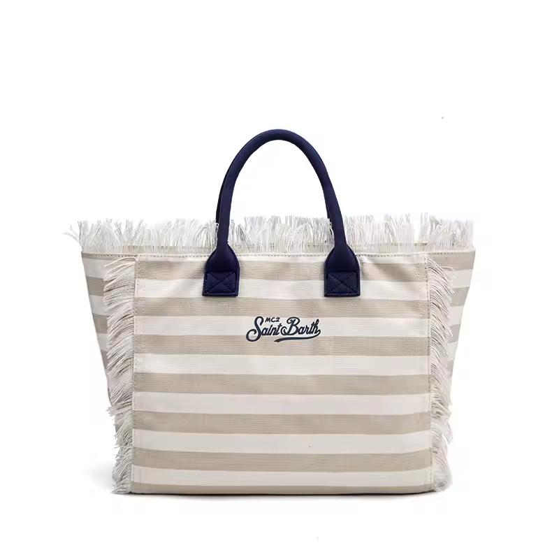 Saint Barth beach bags in hot pink, leopard print, ivory and natural straw – colorful canvas totes with boho vibe for summer 2025.
