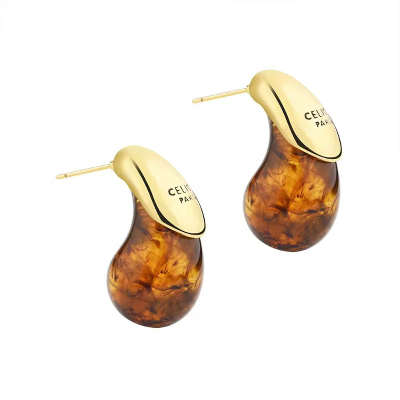 CELISE women’s drop earrings featuring clear resin and gold-plated dome design – stylish minimalist jewelry for everyday and special occasions