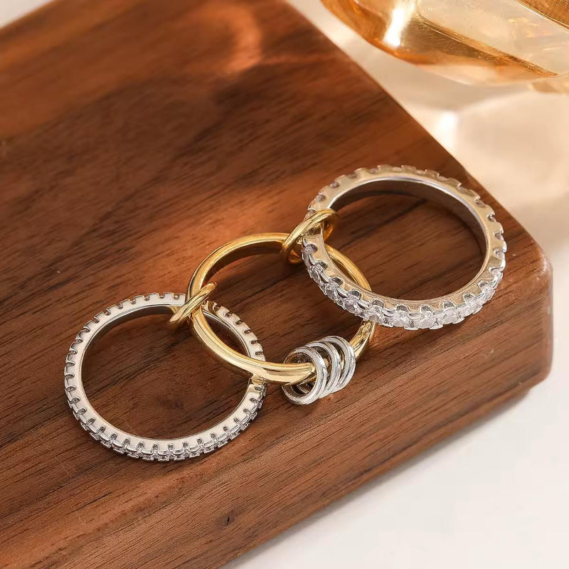 Modern minimalist ring in mixed metals – gold and silver tones with sparkling zircon, stackable and elegant