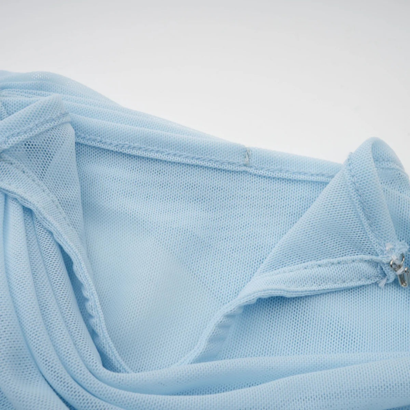 Sky blue draped chiffon evening gown named Chantelle, featuring elegant soft pleats, shoulder wrap detail, and floor-length silhouette – perfect for weddings, galas, and formal events.