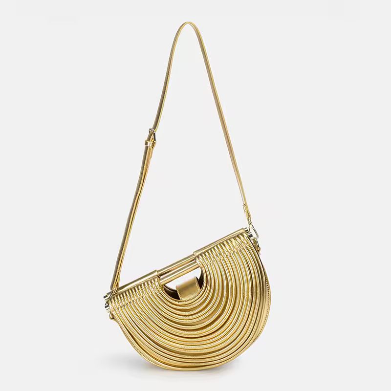 Luxury gold fan-shaped clutch bag Ventaglio d’Oro – structured metallic designer handbag with sculptural design.
