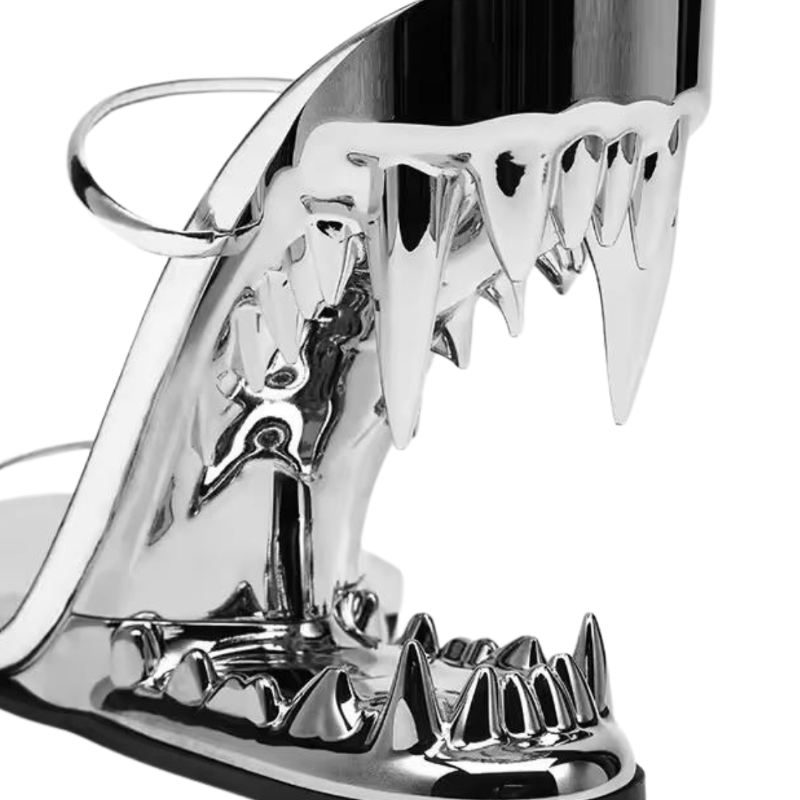 FATAL BITE Heels in Chrome Silver – futuristic high heels with 3D metal shark bite heel, shiny silver sandals for women, edgy designer footwear for summer fashion 2025