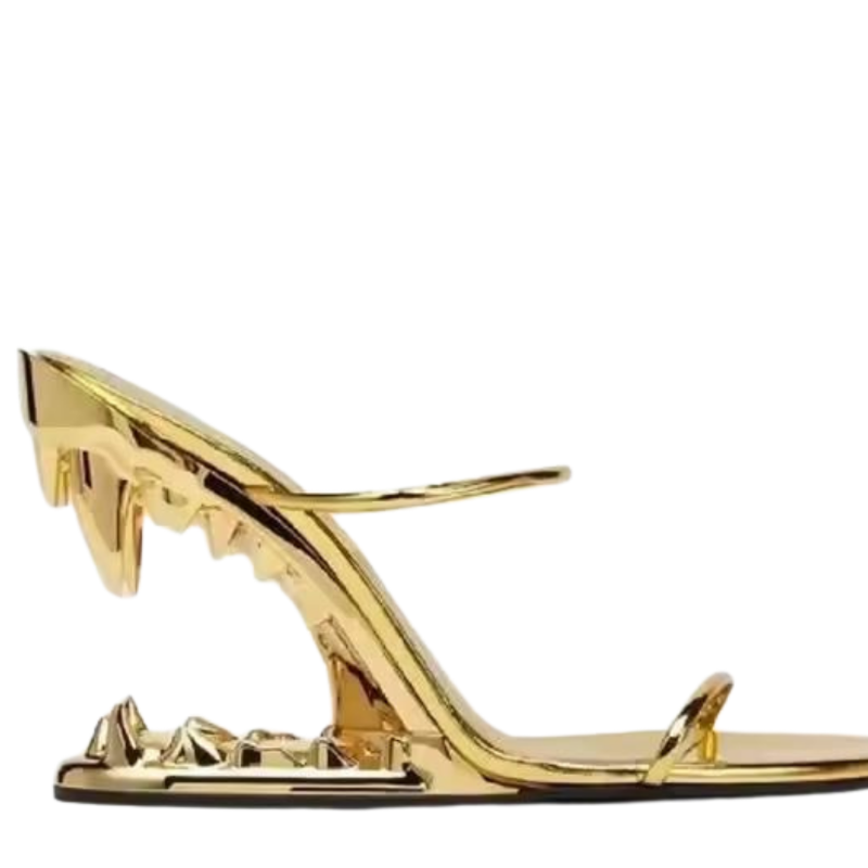 FATAL BITE Heels in Mirror Gold – luxury gold high heel sandals with sculpted metal jaw heel, bold designer shoes for party, runway, or influencer fashion shoots
