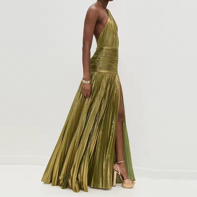 Side view of elegant pleated metallic maxi dress in olive-gold, featuring thigh-high slit and halter neckline, showcasing flowy movement and glamour.