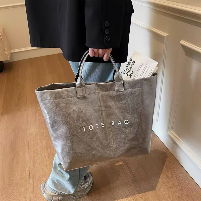 Grey jelly-style PVC tote bag with modern lettering – stylish large shoulder bag for shopping, market days, or moms on the go.