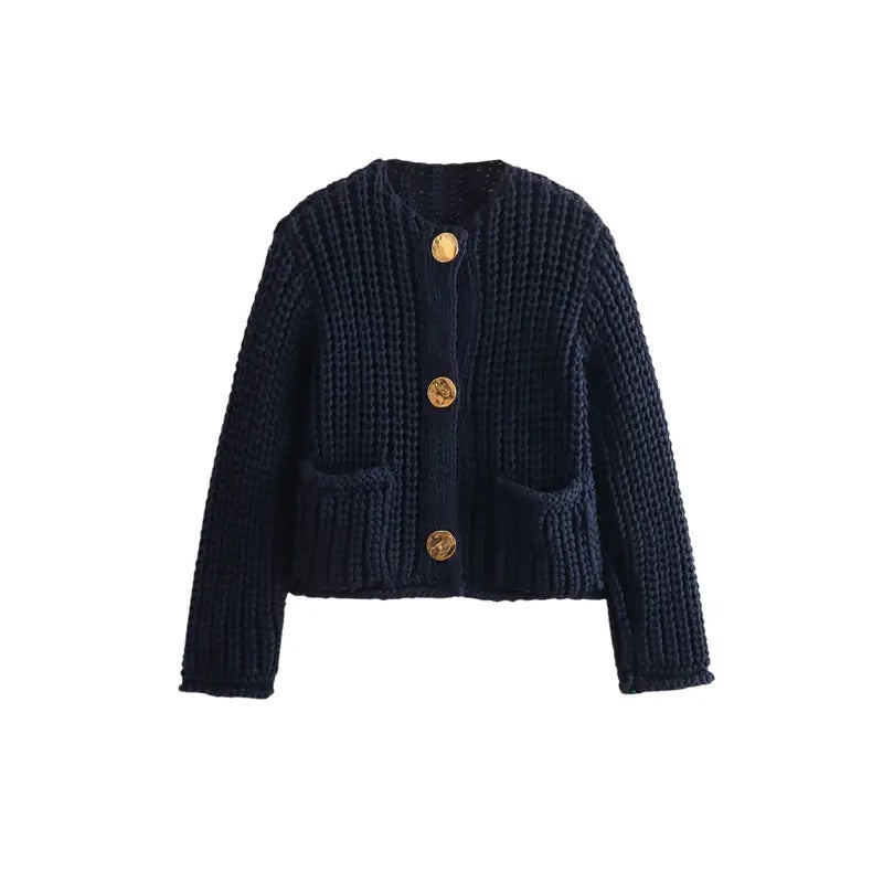 Chic & Charm Noir Élégance Cardigan – Luxury Italian knit black cardigan with gold button details. Oversized fit perfect for layering. Made in Italy with ultra-soft fabric for fall and winter. Available in sizes S, M, L.