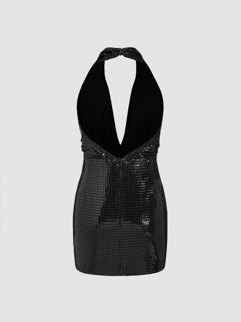 Side view of shimmering black sequin party dress with halter strap and curve-hugging silhouette – backless and bold eveningwear.
