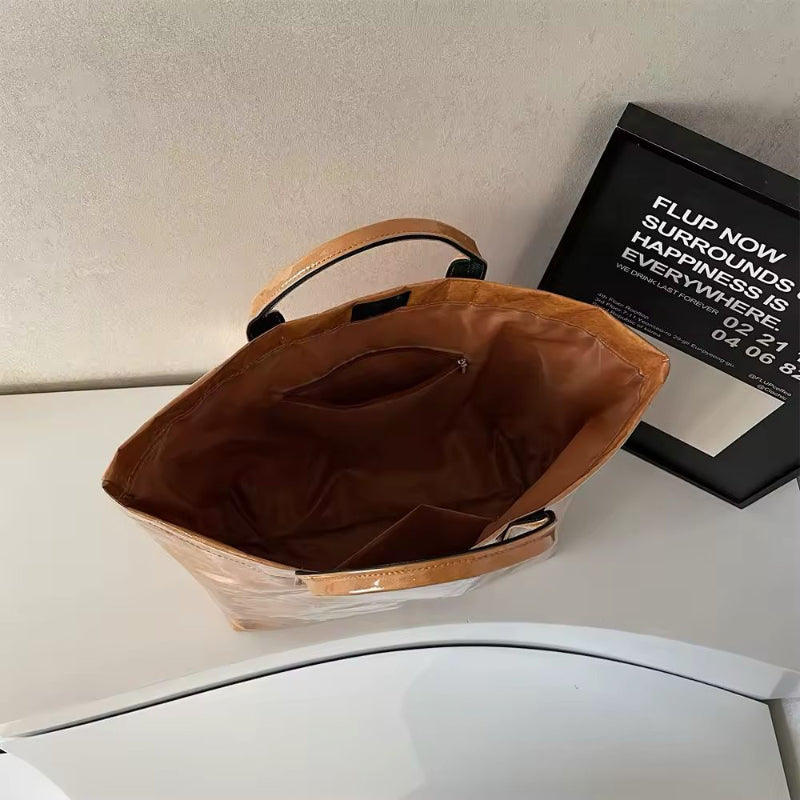 Transparent waterproof jelly tote bag in glossy PVC with bold letter print, shown in modern color variations – ideal for beach, city shopping, moms, and travel. Stylish large capacity handbag with short handles.