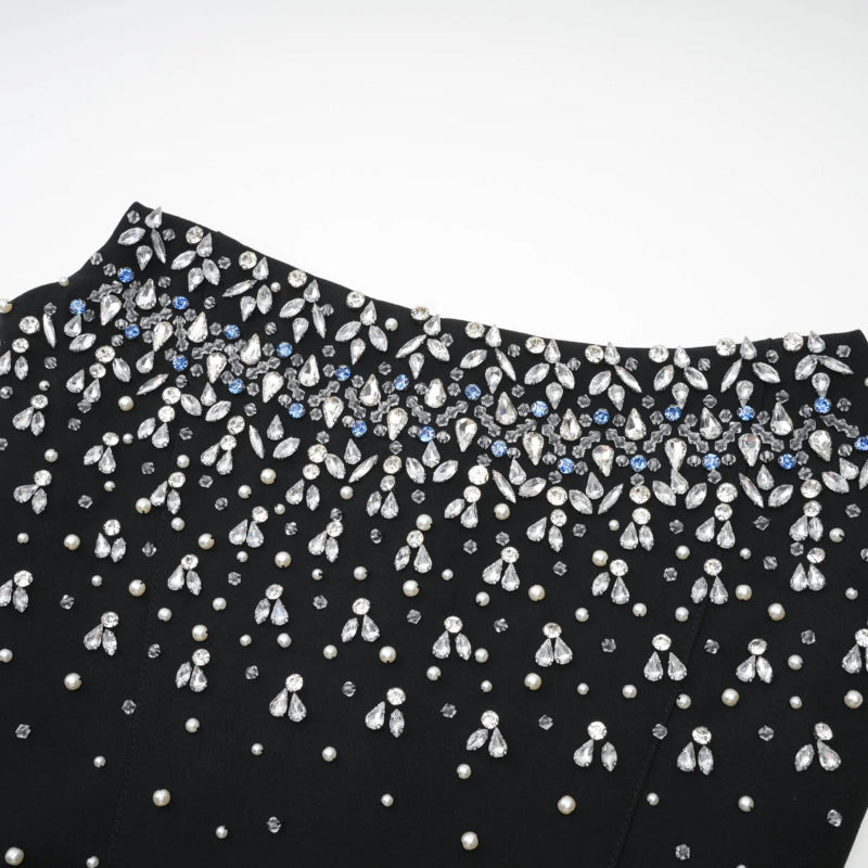 Close-up detail of pearls and crystals on Éclat de Lune black hand-embellished dress”