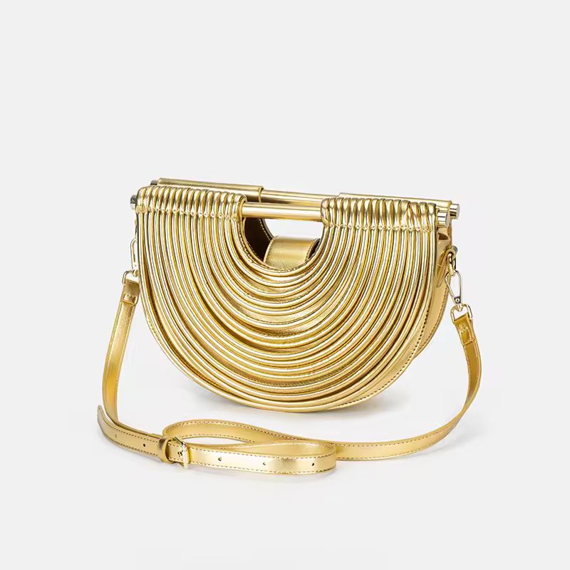 Luxury gold fan-shaped clutch bag Ventaglio d’Oro – structured metallic designer handbag with sculptural design.