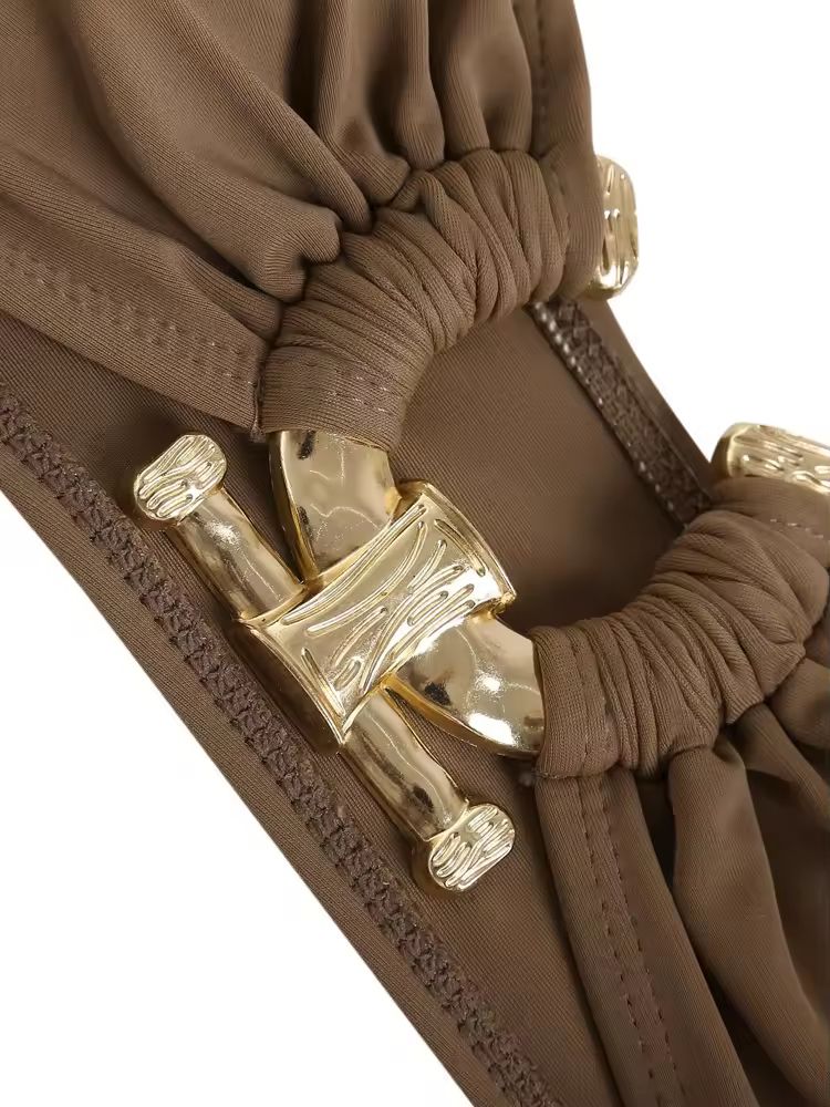 Elegant mocha brown bandeau bikini with gold hardware ring and adjustable low-rise bottoms – minimalist beachwear for summer 2025.