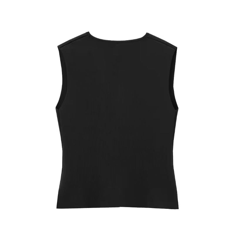Paris City Muse black elegant two-piece outfit – sleeveless vest with gold accents and long pleated maxi skirt – perfect for evening events and city strolls.