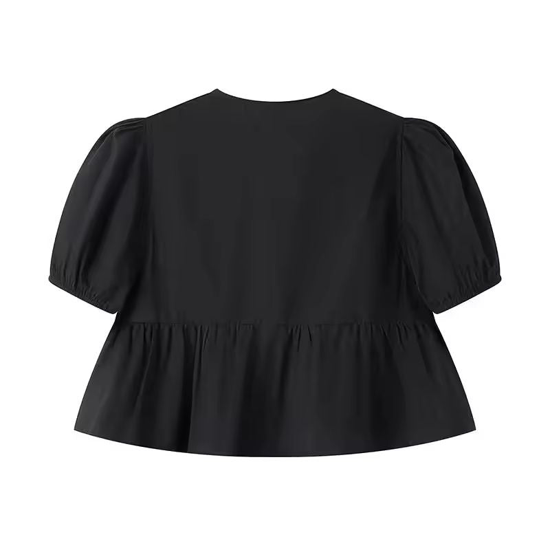 Black tie-front summer blouse with puff sleeves and soft flared hem, trendy and bold casual wear for women.