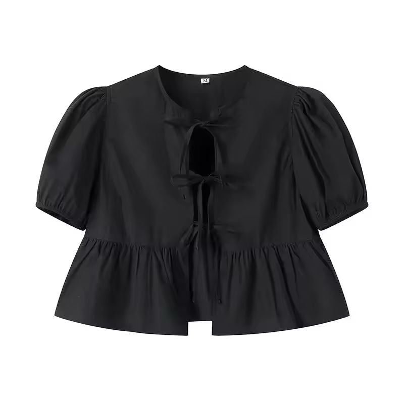 Black tie-front summer blouse with puff sleeves and soft flared hem, trendy and bold casual wear for women.