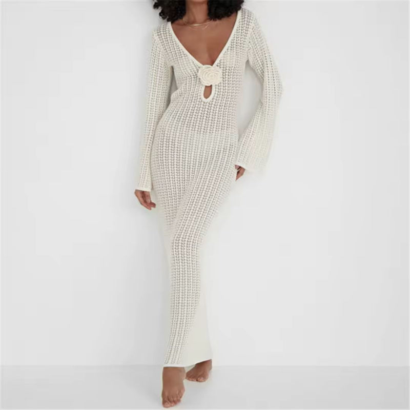 Back view of a backless ivory crochet dress with open knit design and tie-neck closure – summer vacation outfit