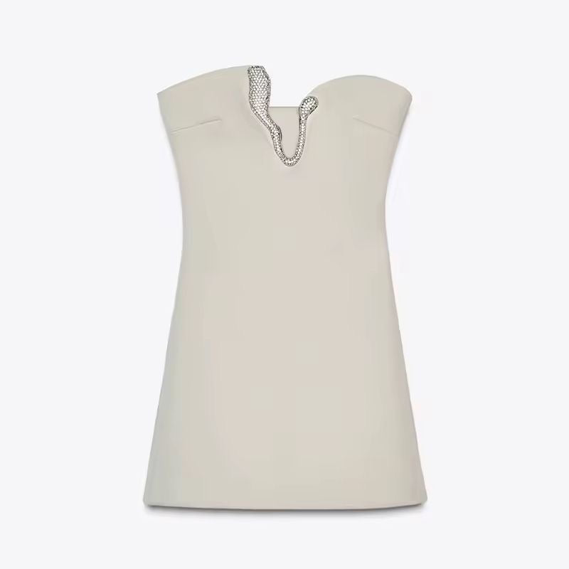 Detail of deep V-neck with rhinestone embellishment – strapless mini dress for summer events