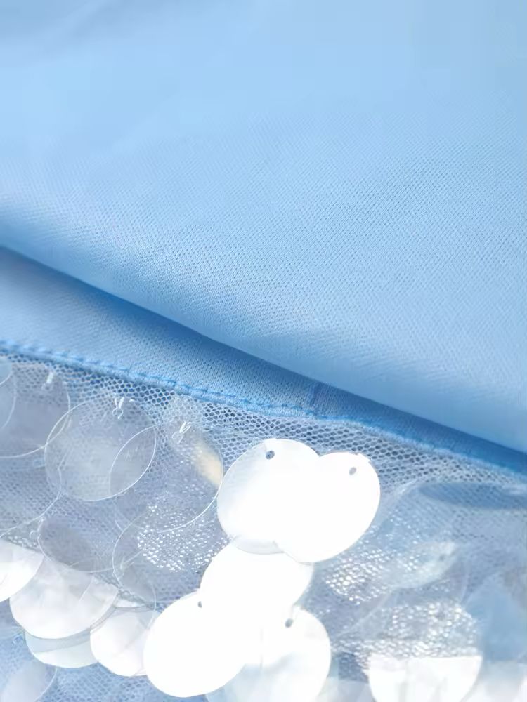 Shimmering sequin and linen-polyester fabric blend in light blue, airy and luxurious texture.