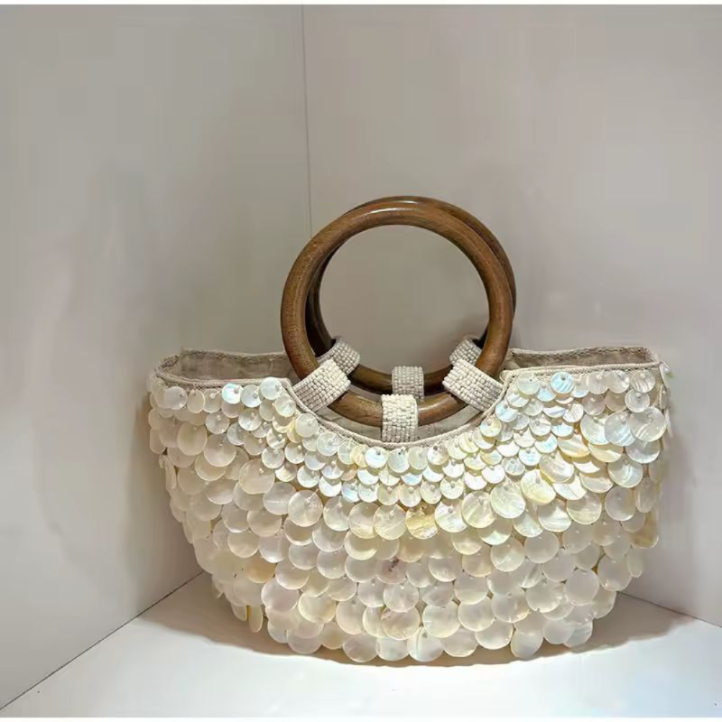 SHELLA handmade straw clutch with wooden handle and shimmering shell disc design – 36x28cm”