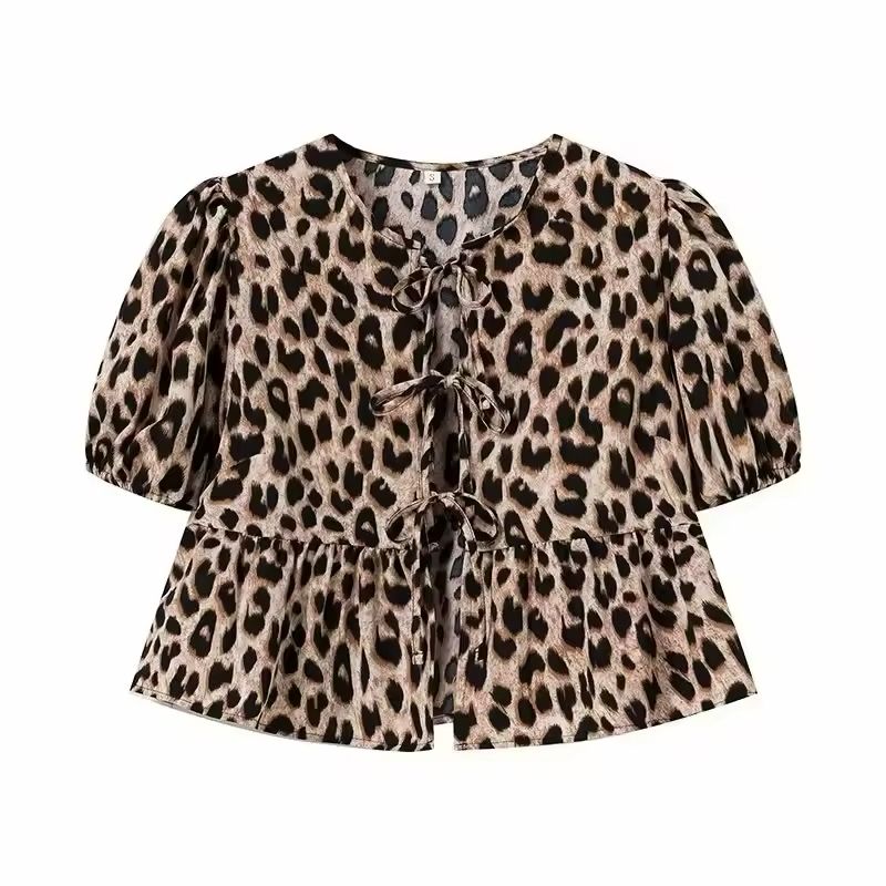 Leopard print tie-front summer blouse with puff sleeves and soft flared hem, trendy and bold casual wear for women.