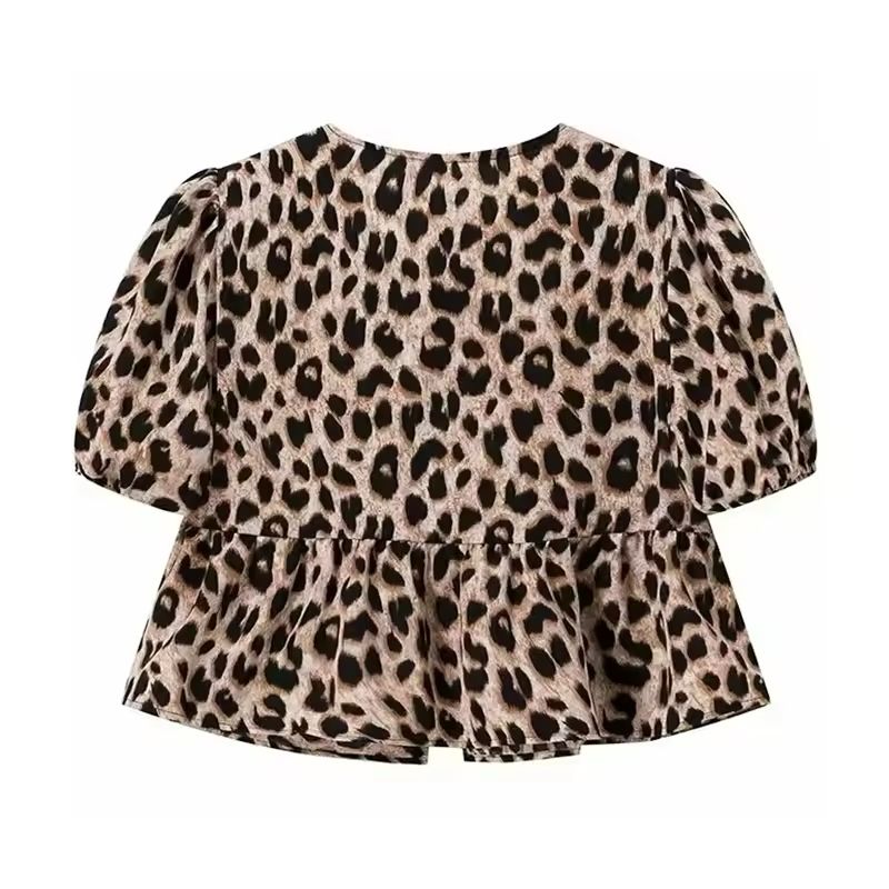 Leopard print tie-front summer blouse with puff sleeves and soft flared hem, trendy and bold casual wear for women.