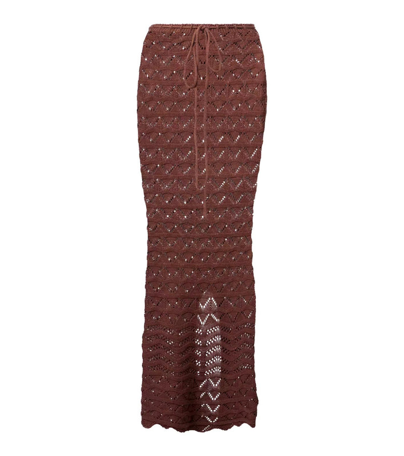 Close-up of Sahara Boho high-waisted maxi skirt with adjustable drawstring and side slit, showcasing lightweight crochet fabric in white and brown.