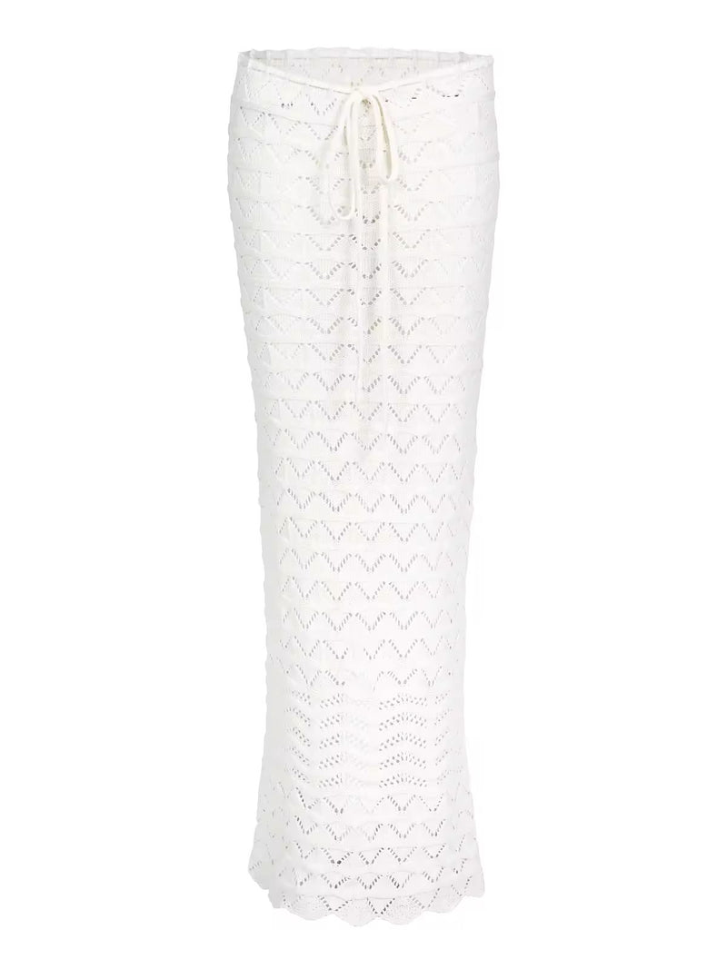 Two-piece Sahara Boho crochet outfit for women in white and brown, featuring an off-shoulder long sleeve crop top and high-waisted maxi skirt with drawstring, perfect for beachwear, festivals, and summer vacations