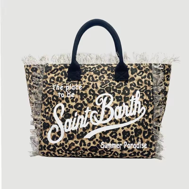 Saint Barth beach bags in hot pink, leopard print, ivory and natural straw – colorful canvas totes with boho vibe for summer 2025.