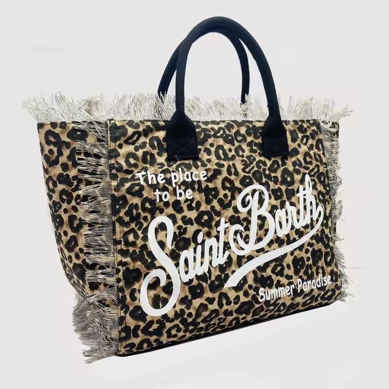 Saint Barth beach bags in hot pink, leopard print, ivory and natural straw – colorful canvas totes with boho vibe for summer 2025.