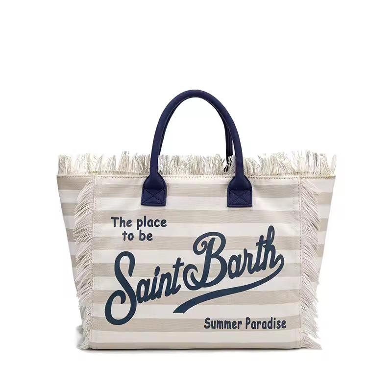 Saint Barth beach bags in hot pink, leopard print, ivory and natural straw – colorful canvas totes with boho vibe for summer 2025.