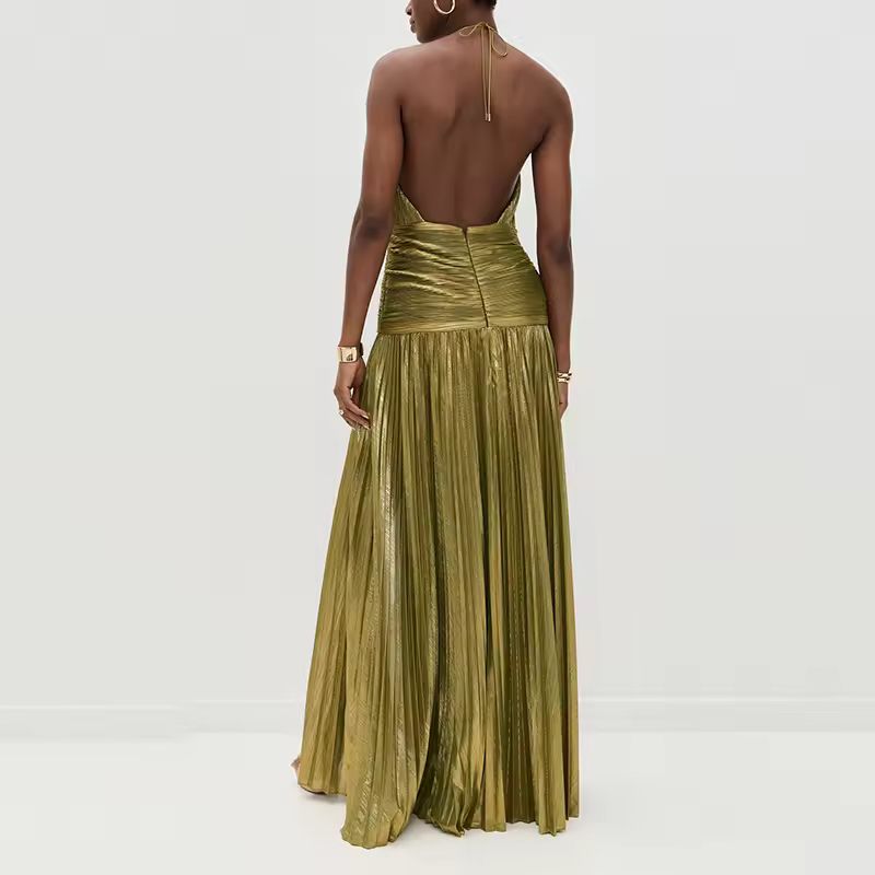 Back view of open-back halter neck gown in gold-olive pleated fabric with wide ruched waistband and floor-length A-line skirt, exuding evening elegance.