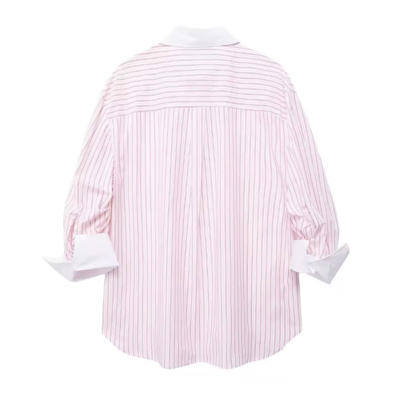 Oversized women’s pink striped button‑down shirt – long sleeves, white contrast collar and cuffs, chest pocket, lightweight poplin fabric, casual summer style.
