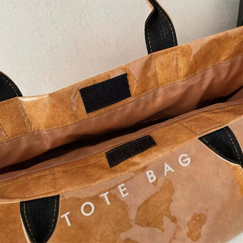 Transparent waterproof jelly tote bag in glossy PVC with bold letter print, shown in modern color variations – ideal for beach, city shopping, moms, and travel. Stylish large capacity handbag with short handles.