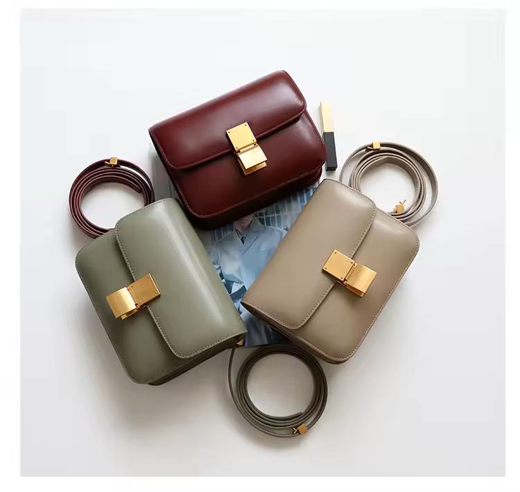 Classic leather shoulder bag with gold clasp and soft texture — warm-toned minimalist leather accessory for fall and winter.