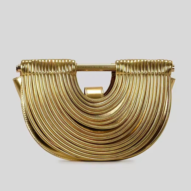Luxury gold fan-shaped clutch bag Ventaglio d’Oro – structured metallic designer handbag with sculptural design.