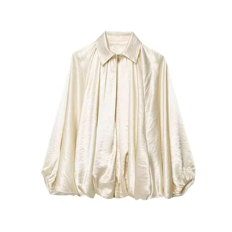 Champagne ivory satin‑feel blouse with turn‑down collar and statement sleeves